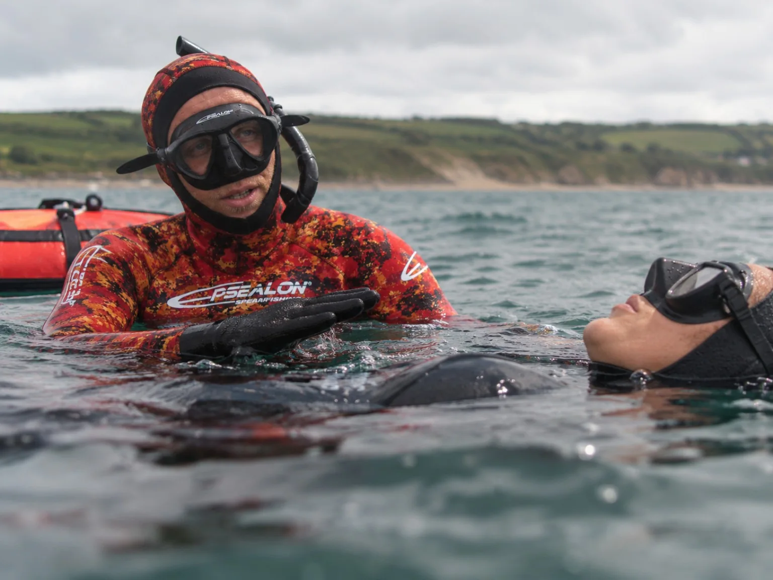 Ian Donald teaching a freediving student in the water
