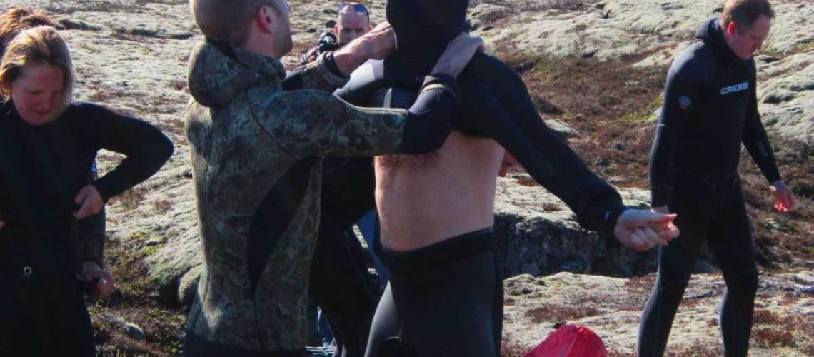 putting-on-a-freediving-wetsuit